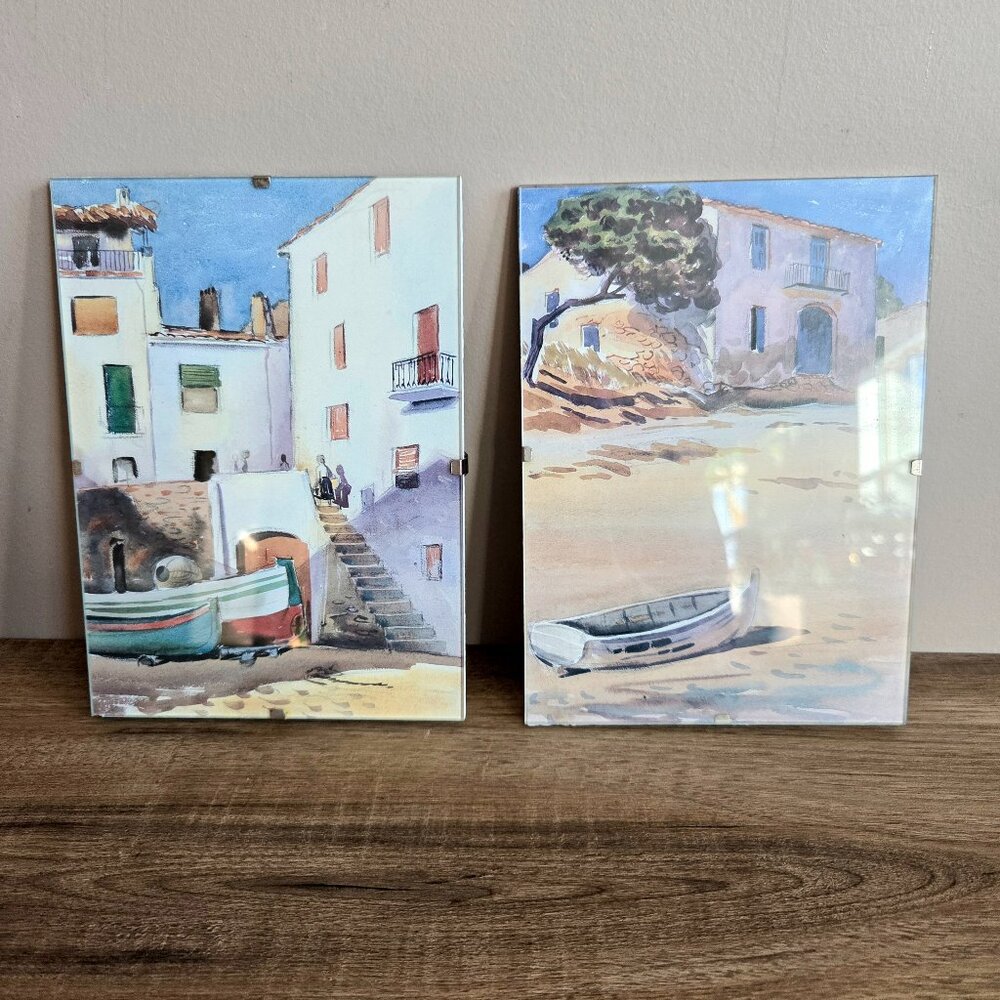 2 pictures covered with glass.